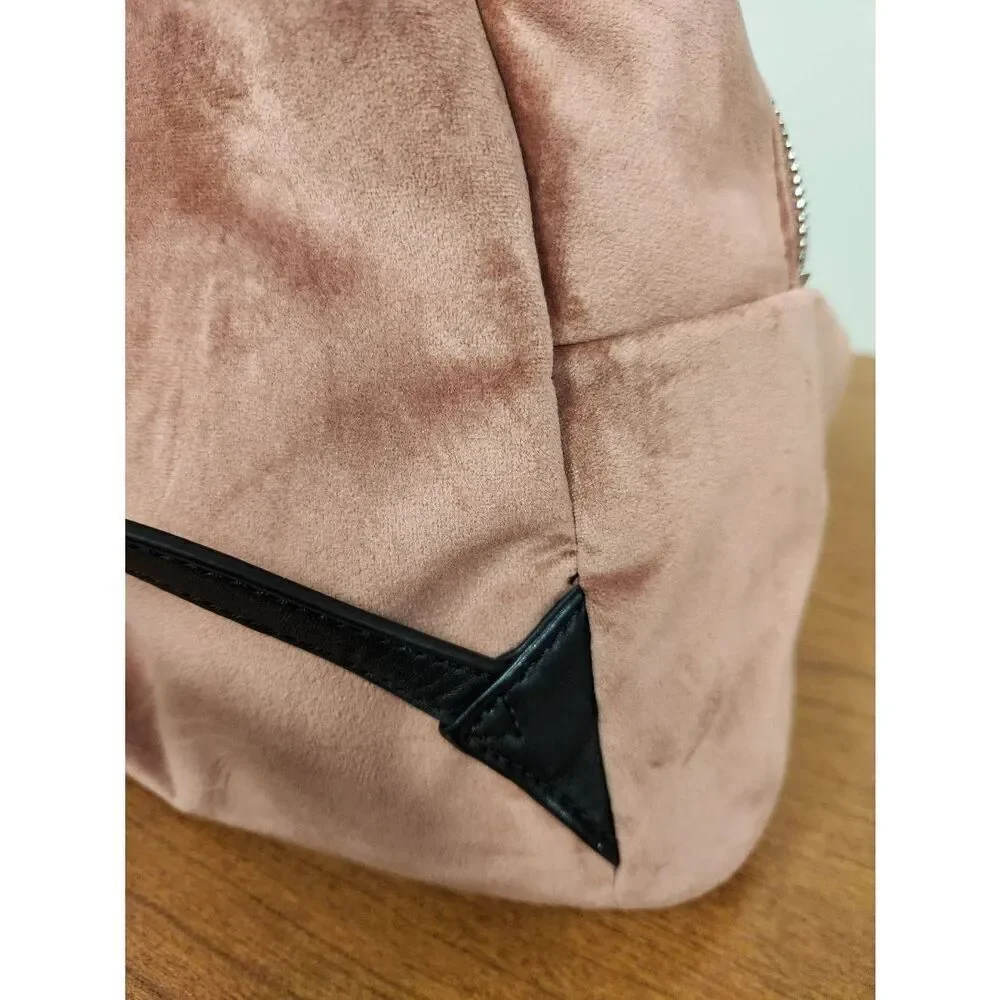 Guess small velvet feel pink backpack with black straps and pom. Measures approx